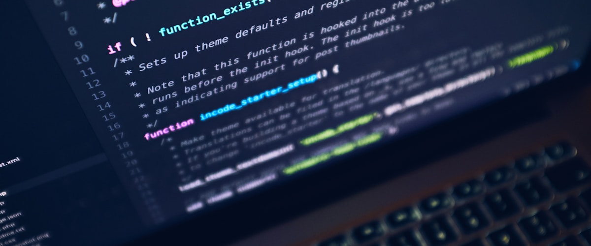 Code on a widescreen monitor